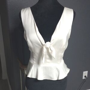 Gianni Bini White Sleeveless Peplum Blouse. NWOT